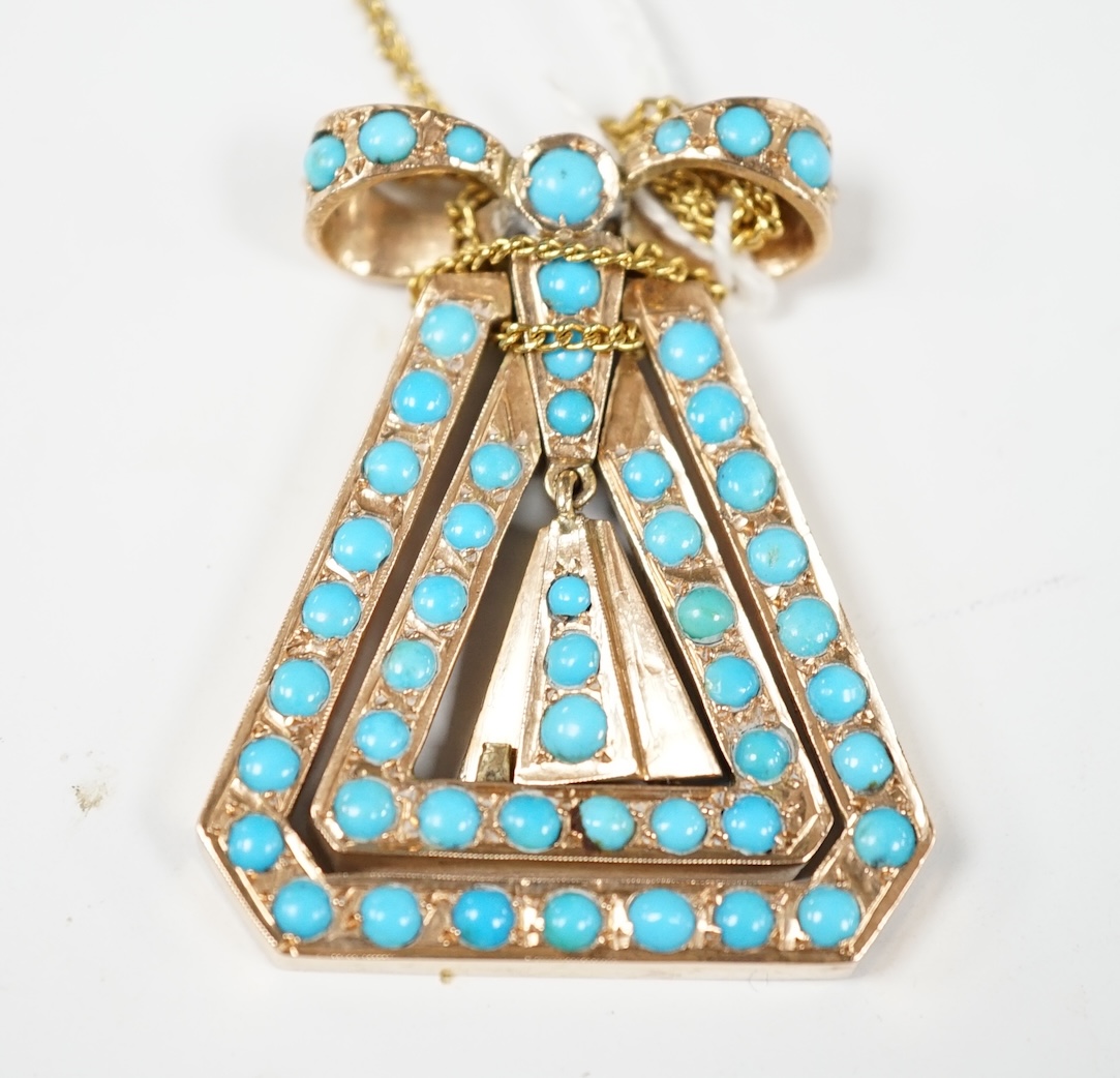 A yellow metal and turquoise cluster set triangular pendant, with ribbon bow terminal, 43mm, on a yellow metal chain. Condition - fair